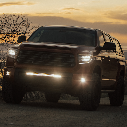 Load image into Gallery viewer, 30 led light bar mounted on a toyota tundra as a behind the grille led light bar
