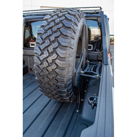 Load image into Gallery viewer, DV8 Offroad TCGL-02 Stand Up In-Bed Tire Carrier for 20-24 Jeep Gladiator JT
